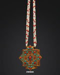 Decorative necklace with a pendant on a black background