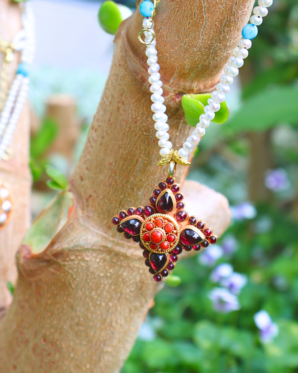 Necklace with a star-shaped pendant on a wooden branch