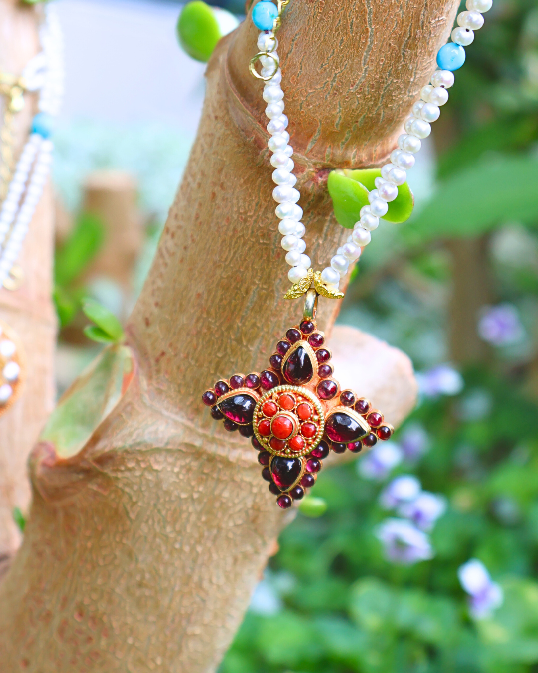 Necklace with a star-shaped pendant on a wooden branch